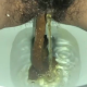 A very cute girl shits into a toilet from under ass. A nice hang and drop, then a look at the product. Filmed from a between the legs perspective. Vertical format video. Under a minute.